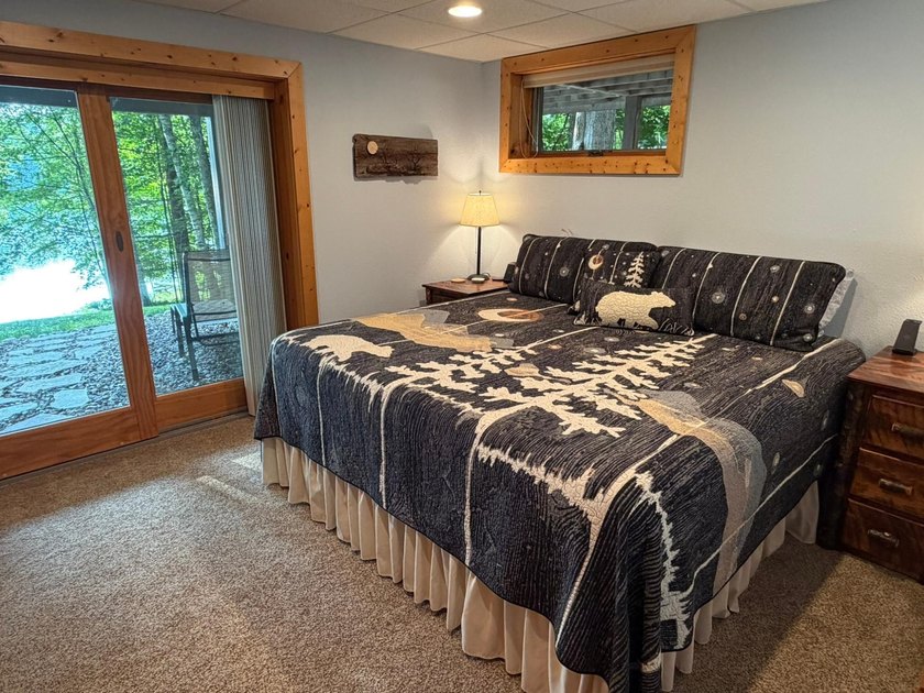 BIRD LAKE CHARMER. Tucked in the woods, this year-round home - photo 16