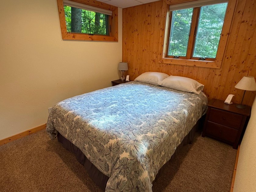 BIRD LAKE CHARMER. Tucked in the woods, this year-round home - photo 19