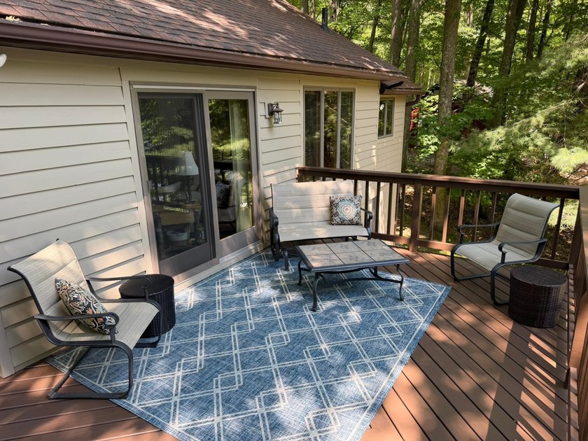 BIRD LAKE CHARMER. Tucked in the woods, this year-round home - photo 22