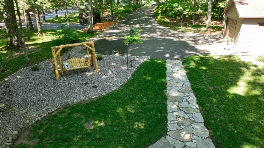 BIRD LAKE CHARMER. Tucked in the woods, this year-round home - photo 25