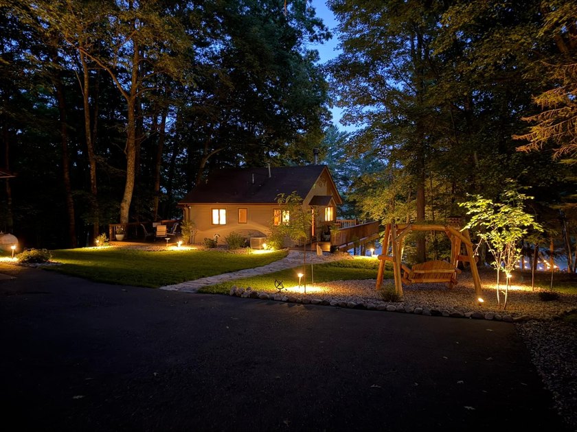 BIRD LAKE CHARMER. Tucked in the woods, this year-round home - photo 26