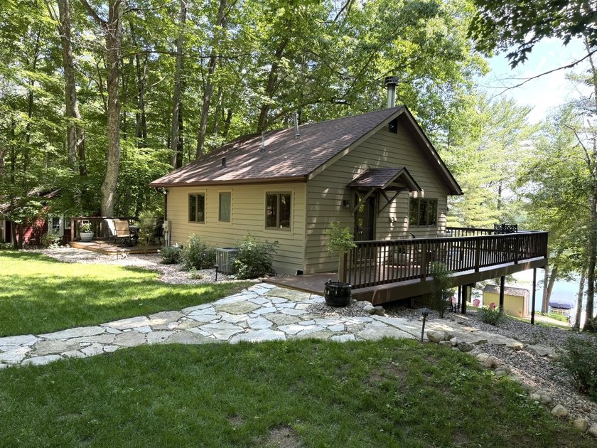 BIRD LAKE CHARMER. Tucked in the woods, this year-round home - photo 32