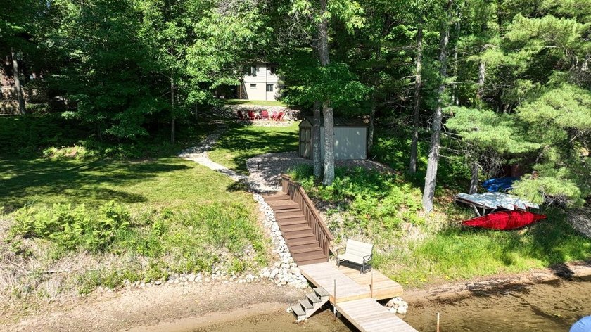 BIRD LAKE CHARMER. Tucked in the woods, this year-round home - photo 40