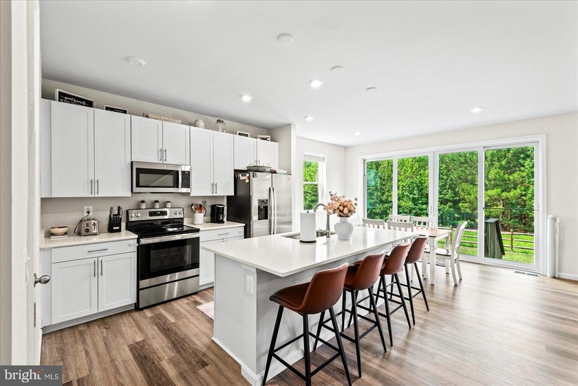 Why wait for new construction? This beautifully maintained - photo 12