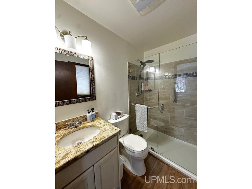 Nestled in one of Marquette's most desirable neighborhoods, this - photo 32