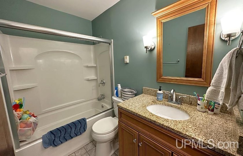 Nestled in one of Marquette's most desirable neighborhoods, this - photo 33