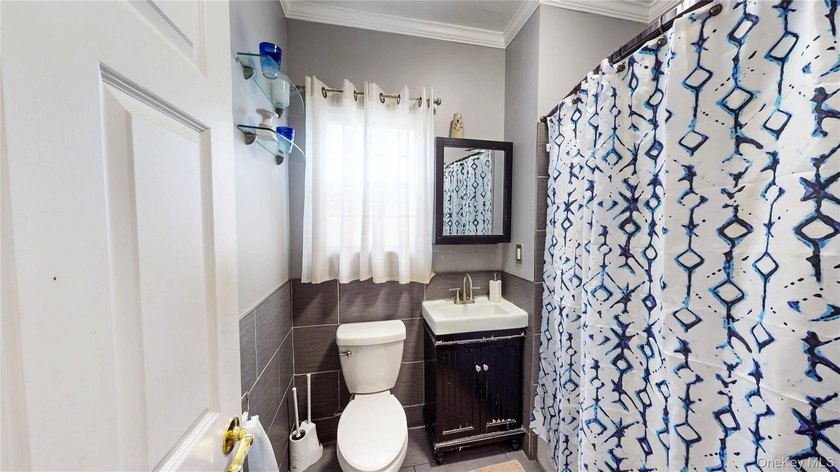 This beautifully maintained legal 3-family semi-detached home - photo 11