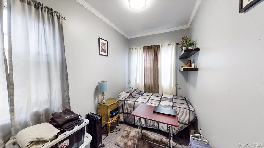 This beautifully maintained legal 3-family semi-detached home - photo 12