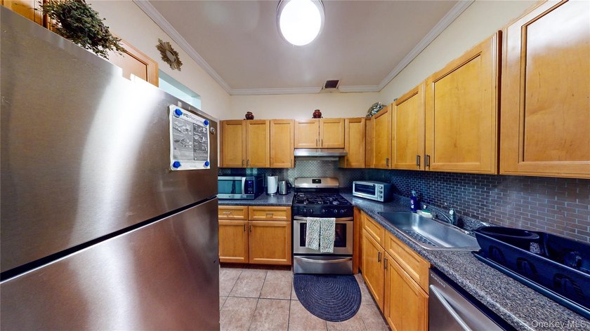 This beautifully maintained legal 3-family semi-detached home - photo 16