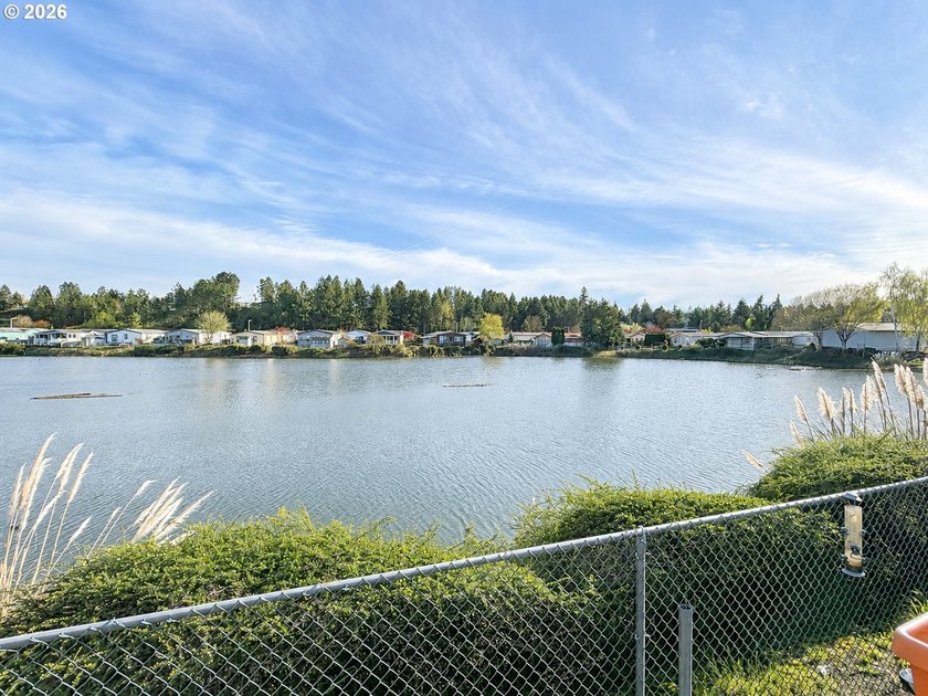 Experience tranquility at Giadanj Lake Estates with this updated - photo 21