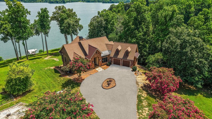 Experience luxury lakefront living in this exceptional 5-bedroom - photo 20