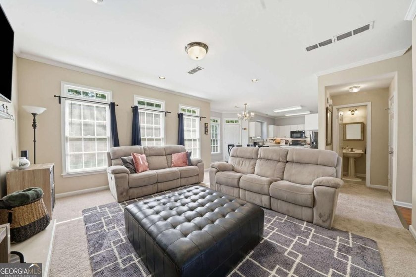 Nestled in the highly sought-after Waters Edge, this traditional - photo 14