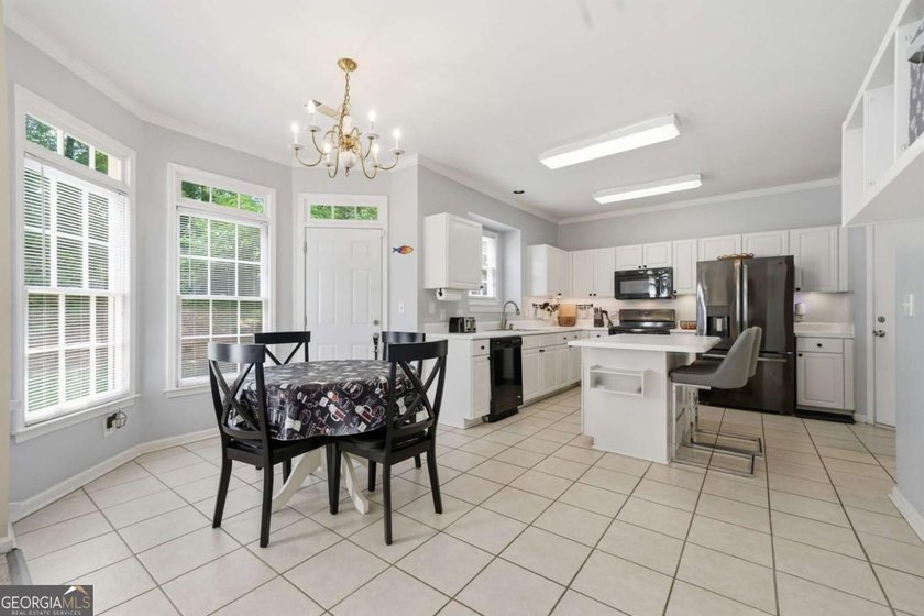 Nestled in the highly sought-after Waters Edge, this traditional - photo 17