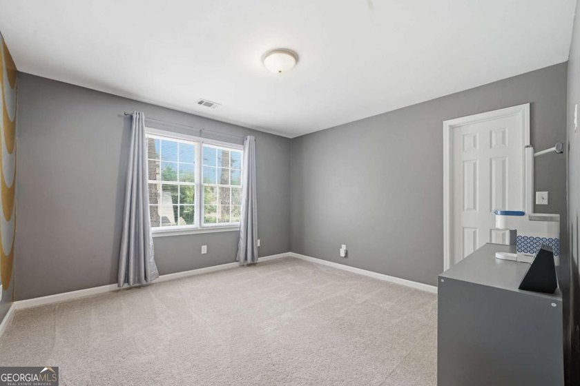 Nestled in the highly sought-after Waters Edge, this traditional - photo 23
