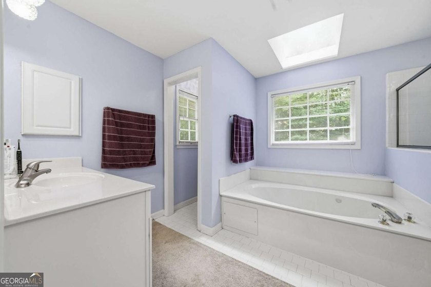 Nestled in the highly sought-after Waters Edge, this traditional - photo 35