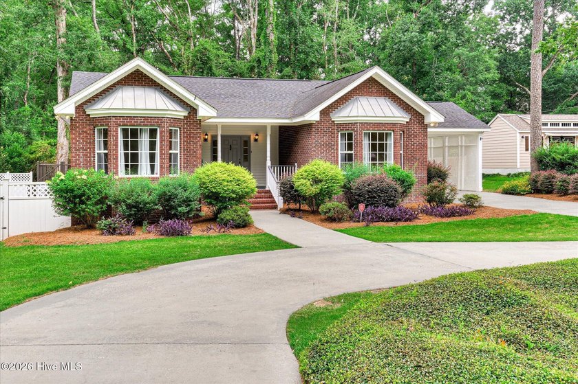 **This stunning brick home truly has it all.** Nestled in one of - photo 2