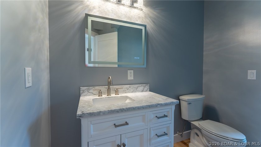Experience Open Space Luxury lakefront living in this custom - photo 47