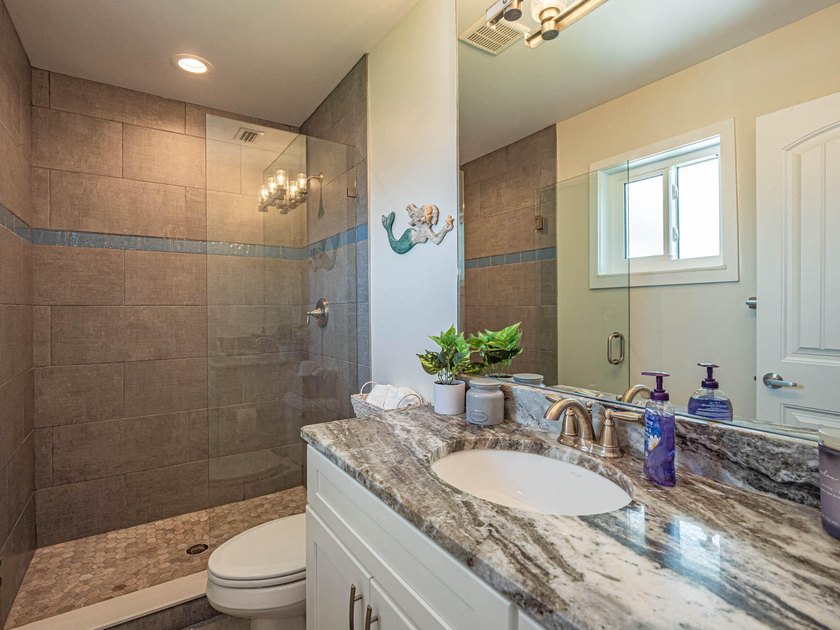 Welcome to this waterfront single-story residence in Coral Cove - photo 18