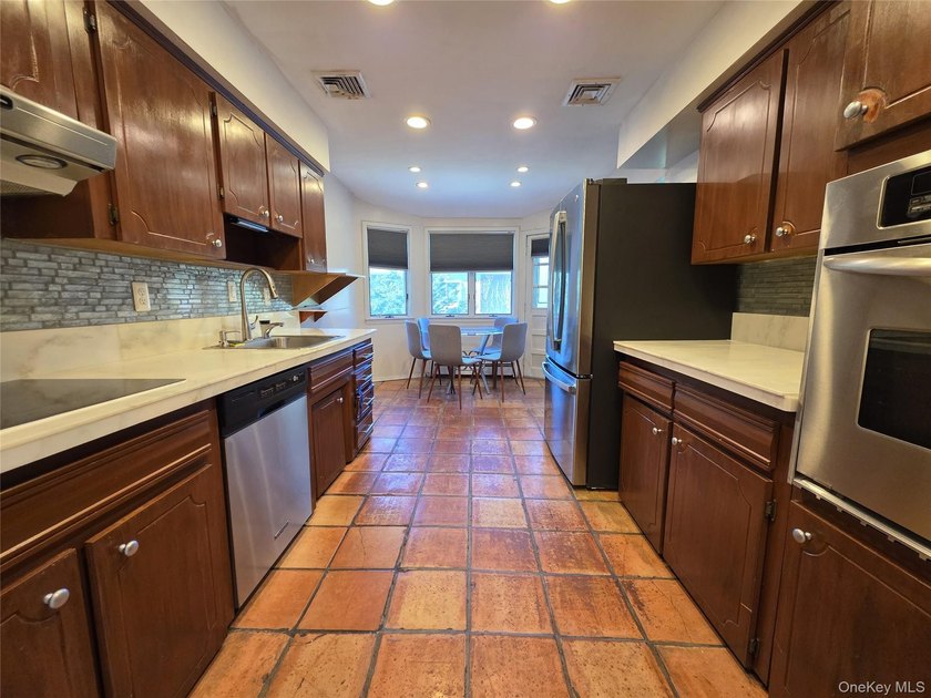 Spacious hi ranch with 4 bedrooms and 3 full bathrooms, set on - photo 7