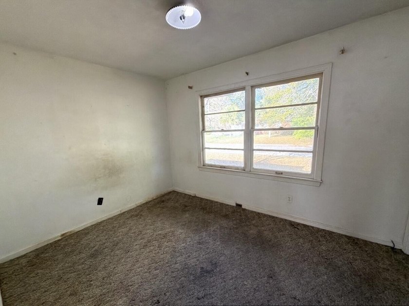 Located just a few miles from the bustling down town area and - photo 16