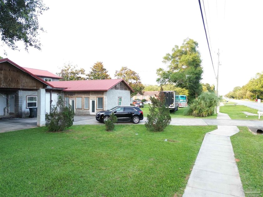 A One-of-a-Kind Opportunity! Offered near land value and zoned - photo 3