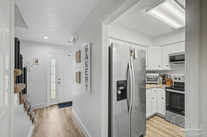 Move-in ready end-unit townhome featuring 2 bedrooms, 1.5 - photo 4