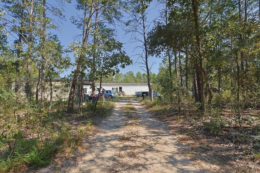 Freeport 5-acre parcel with 3BR/2BA mobile home (2000). Wooded - photo 2