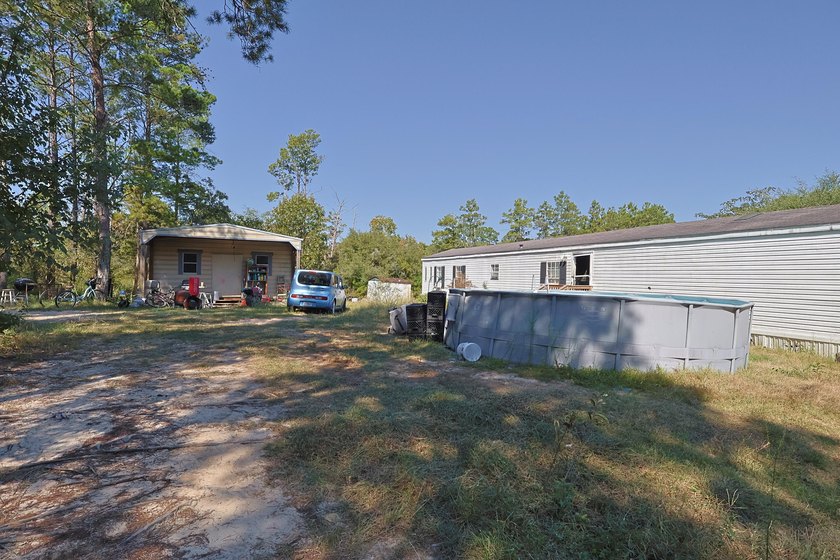Freeport 5-acre parcel with 3BR/2BA mobile home (2000). Wooded - photo 4