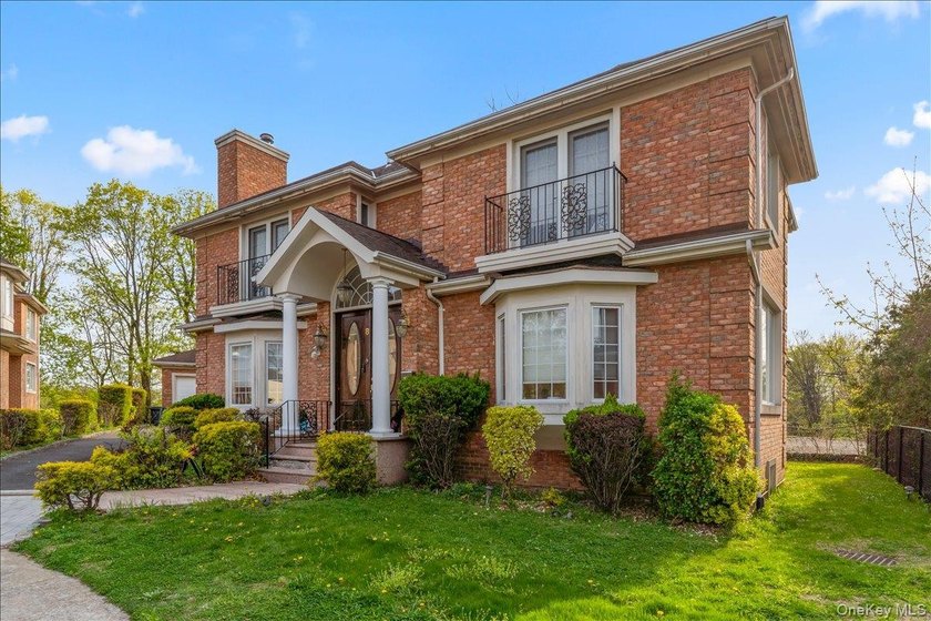 This young Center Hall Brick Colonial offers a spacious and - photo 2