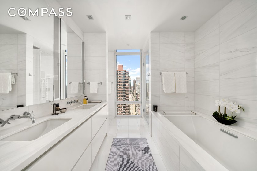 Perched atop the 26th floor of The Charles Condominium, this - photo 9