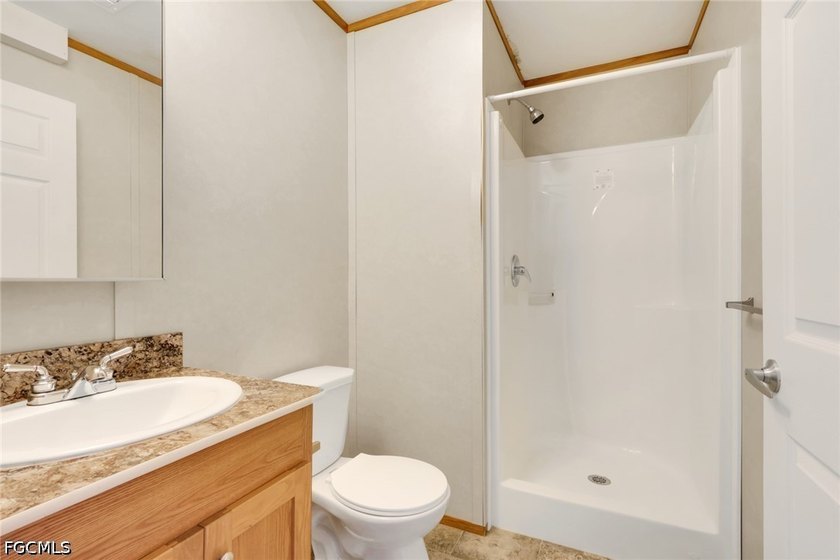 Situated on over half an acre, this pristine three-bedroom - photo 13