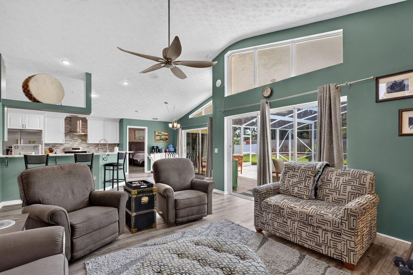 Palm trees sway over your private, screened pool at this move-in - photo 13