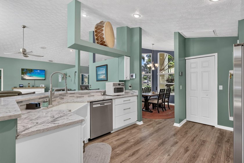 Palm trees sway over your private, screened pool at this move-in - photo 14