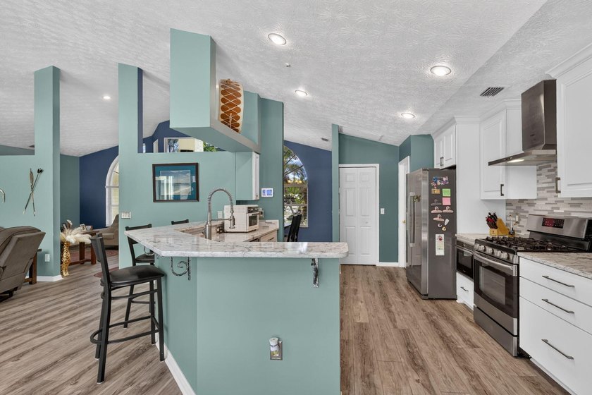 Palm trees sway over your private, screened pool at this move-in - photo 17