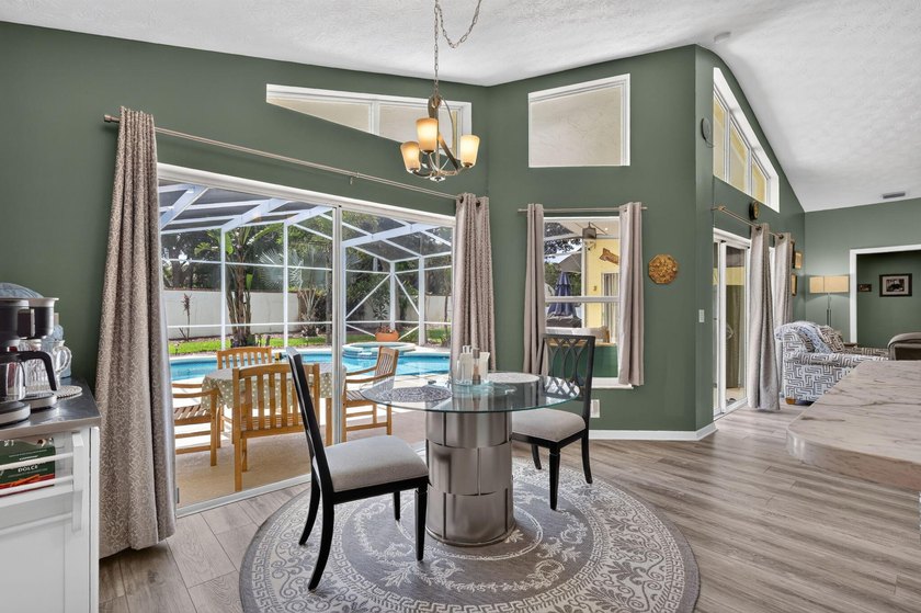 Palm trees sway over your private, screened pool at this move-in - photo 18