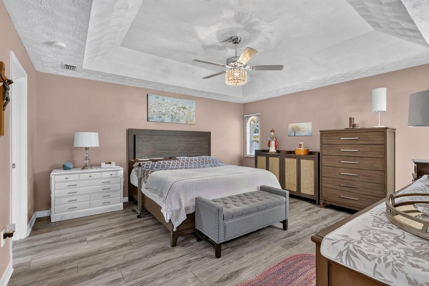 Palm trees sway over your private, screened pool at this move-in - photo 19