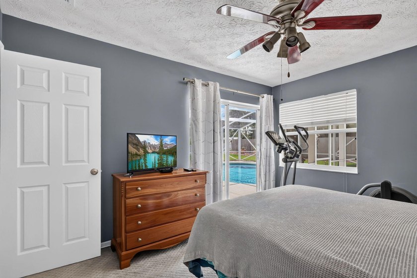 Palm trees sway over your private, screened pool at this move-in - photo 24