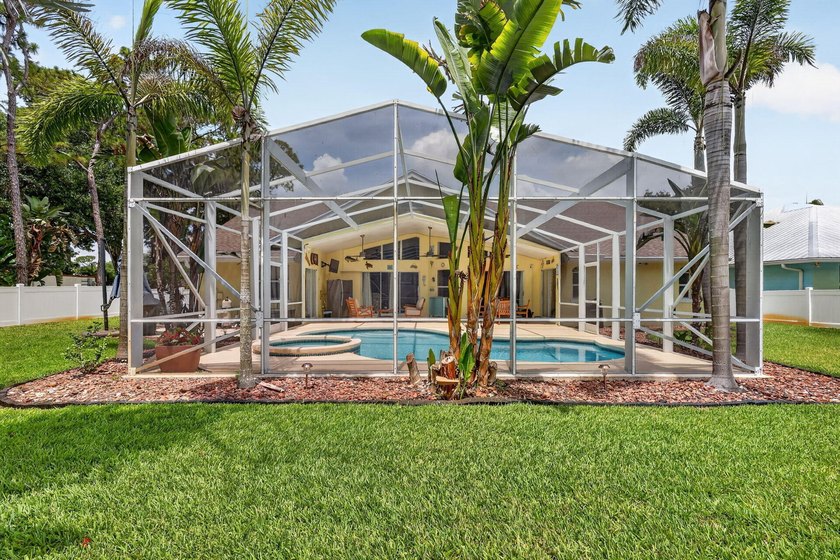Palm trees sway over your private, screened pool at this move-in - photo 34