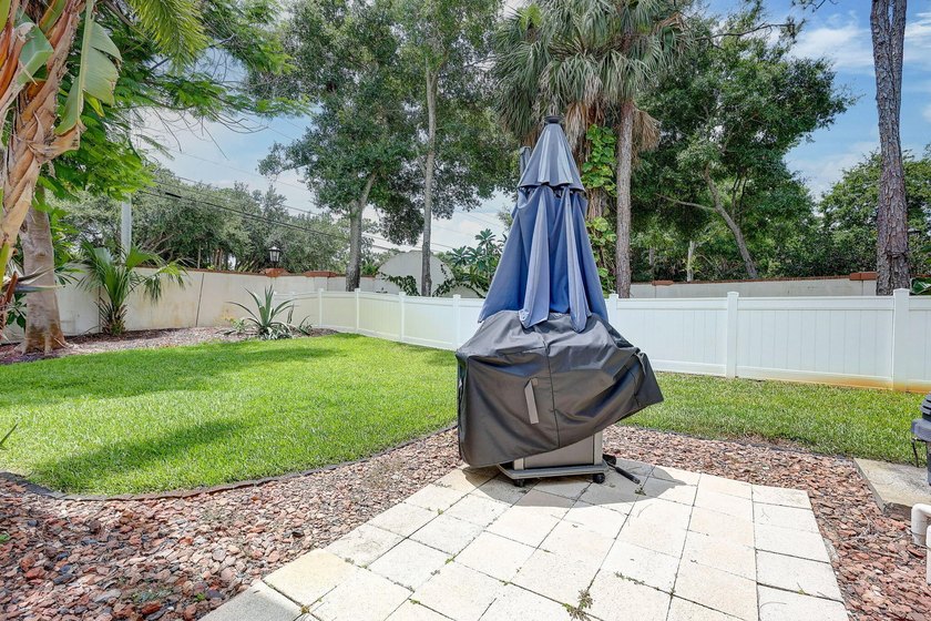 Palm trees sway over your private, screened pool at this move-in - photo 35