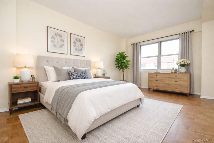 Perched on the top-floor corner, this sun-drenched 2-bedroom - photo 2