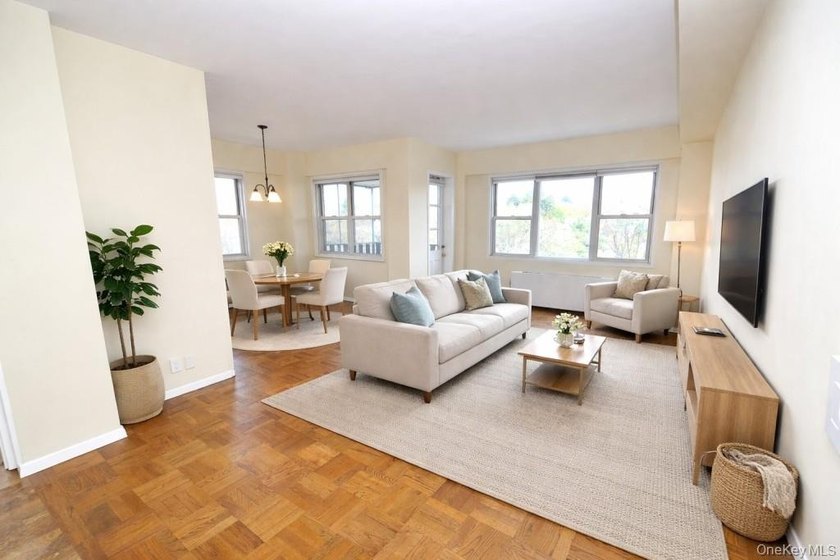 Perched on the top-floor corner, this sun-drenched 2-bedroom - photo 7