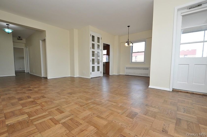 Perched on the top-floor corner, this sun-drenched 2-bedroom - photo 9