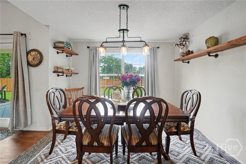 This thoughtfully updated and maintained 4-bedroom ranch sits on - photo 12