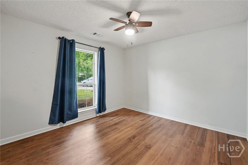 This thoughtfully updated and maintained 4-bedroom ranch sits on - photo 22