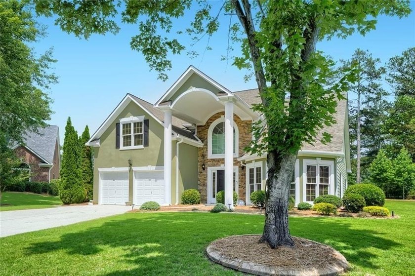 Welcome Home to this Executive home beautifully situated on the - photo 2