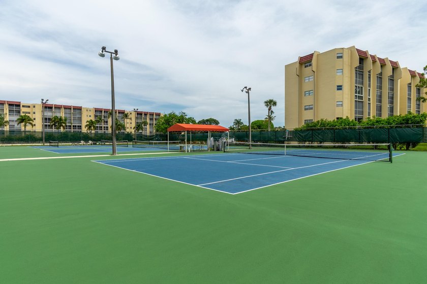 Welcome to this spacious 2-bedroom, 2-bath condominium located - photo 42