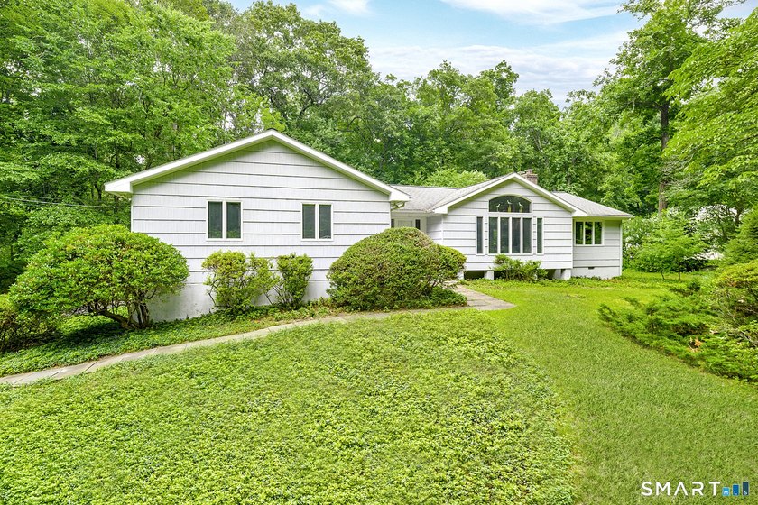 Introducing an exceptional ranch-style retreat nestled on a - photo 3