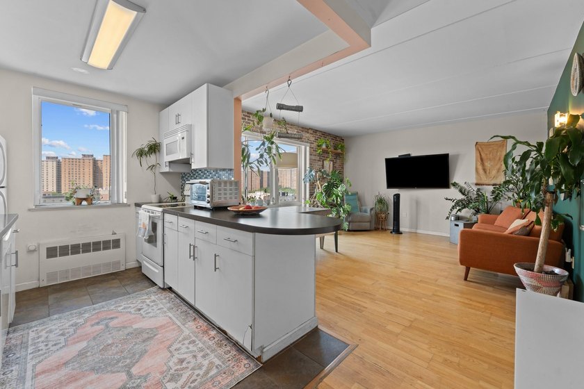 Welcome to 853 Macy Place #8E, a rare top-floor, corner - photo 5