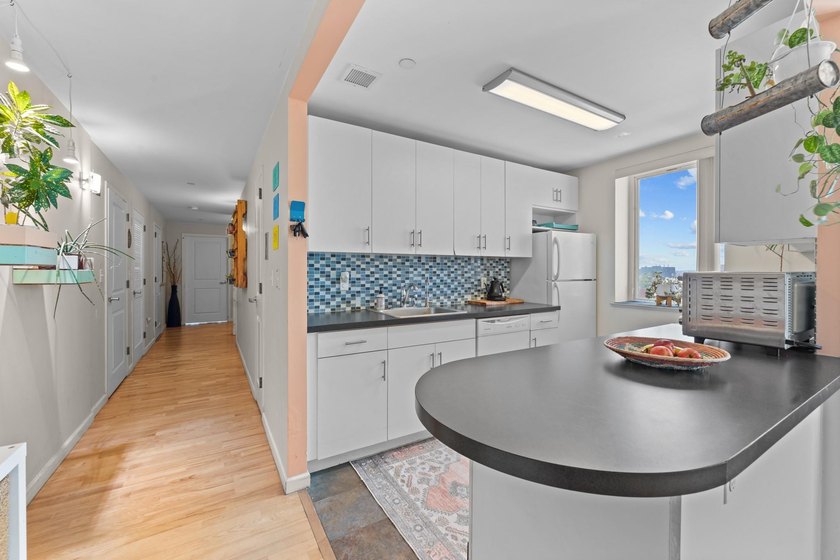 Welcome to 853 Macy Place #8E, a rare top-floor, corner - photo 6
