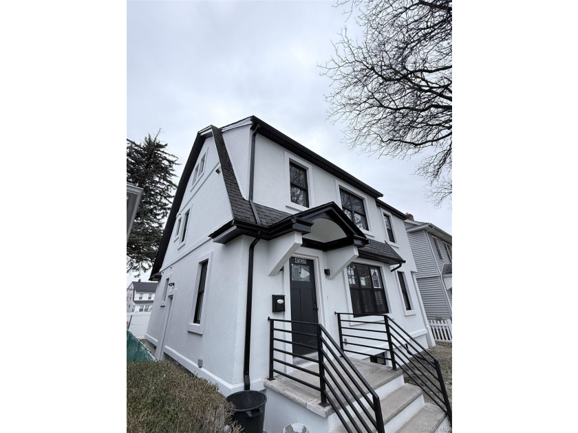 Welcome to this beautifully renovated one-family home with an - photo 2